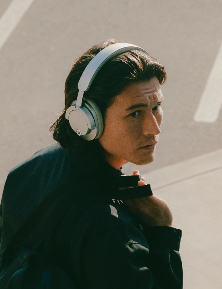 Person focusing with Daisy One headphones